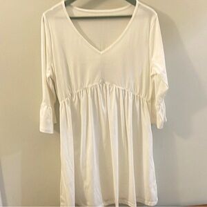 Chic White V-Neck Women's dress with pockets.